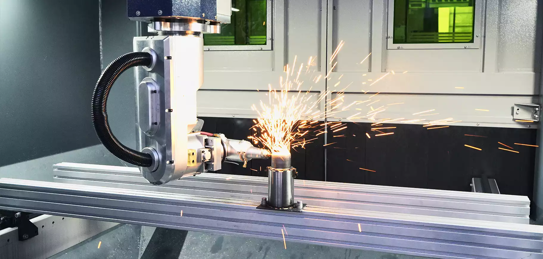 Five-axis laser cutting a vertical tube inside the machine