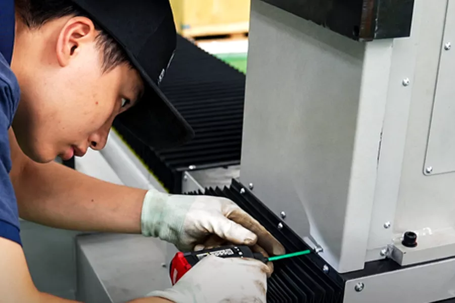 Technician assembling a machine component